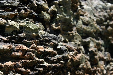 Colorful rough-textured rock. 