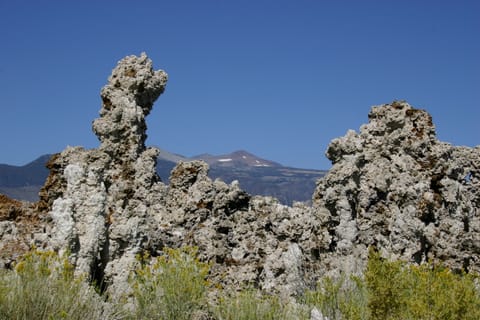 Tufa towers frame snow-dotted mountains at Mono Lake. 