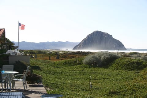 An American flag flies proudly over a patio near Morro Rock.