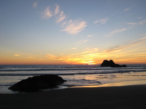 Orange sunset at the beach in Morro Bay. 