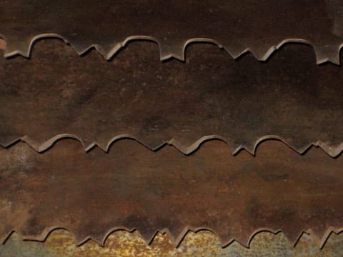 Overlapping rusty saw blades. 